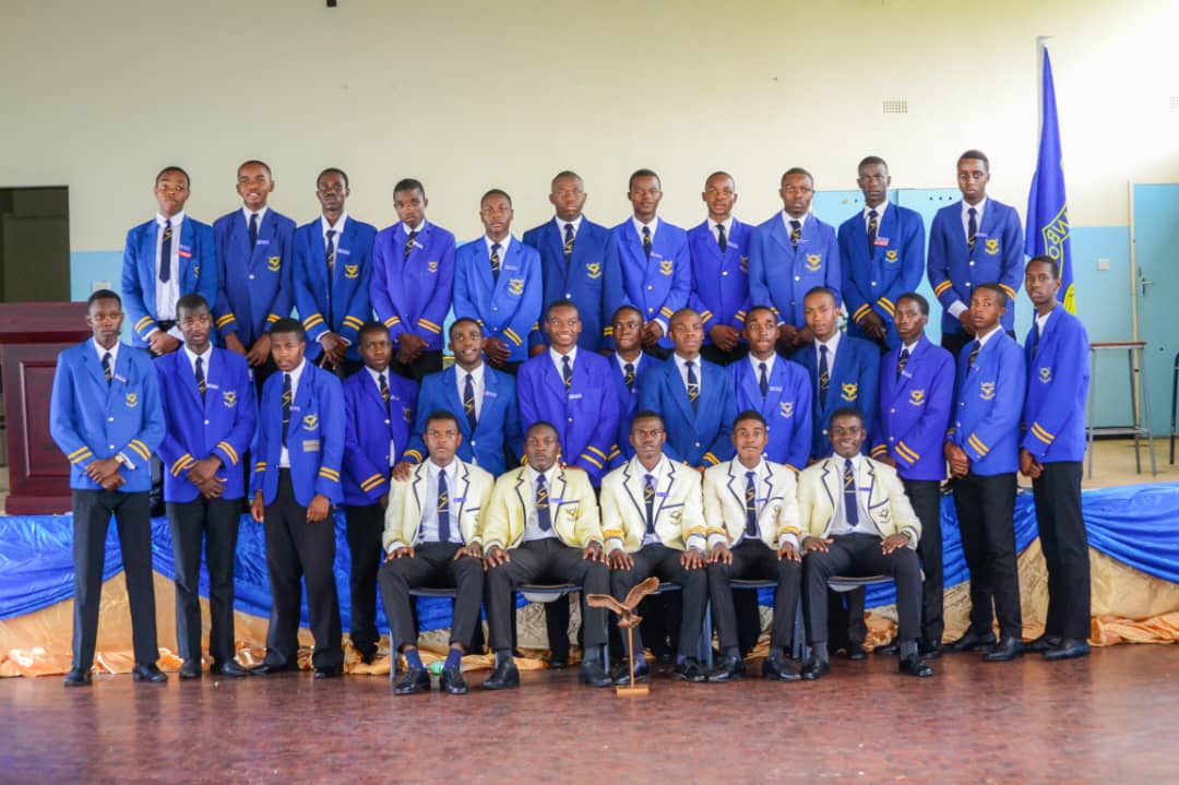 Students in blue blazers group photograph