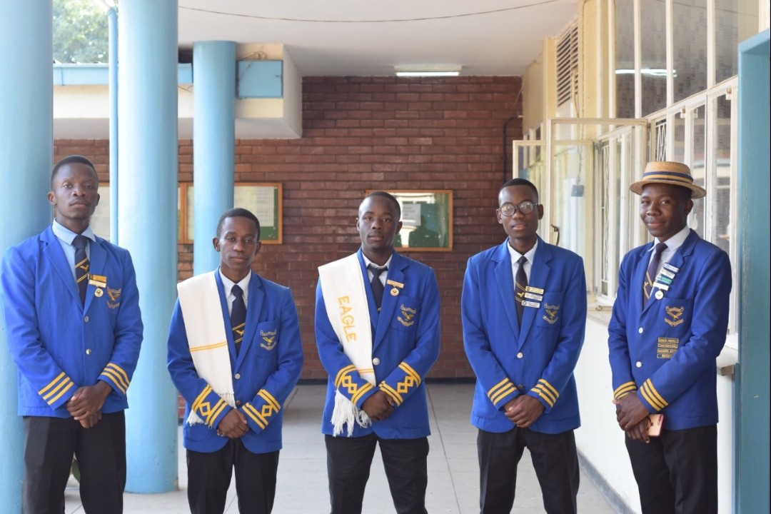 Students standing in a row in the corridor