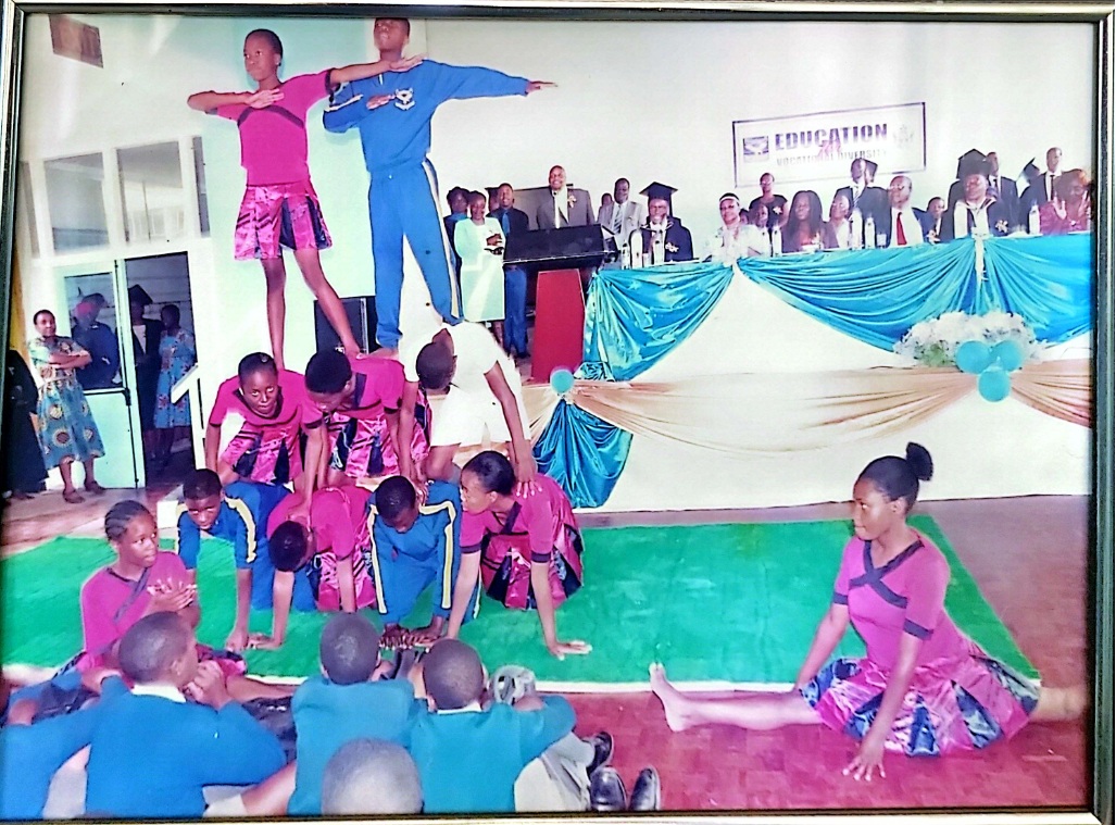 Students performing a balancing display during a school hall event